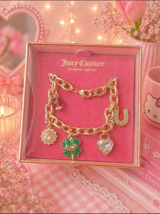 Juicy Couture Jewelry - Juicy Couture Gold-tone Charm Bracelet with Green Clover & Crystal Heart